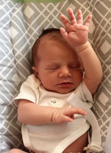 Georgia Mae Harding, already offering praise (or waving hello to her Caldwell family)!